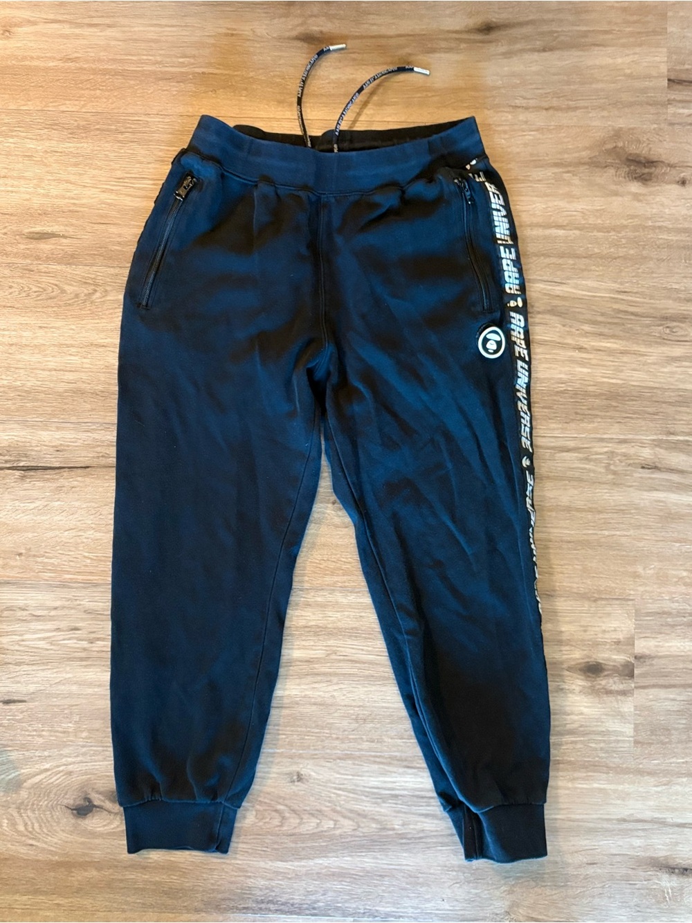AAPE BY A BATHING APE Tape Logo Universe Sweatpants